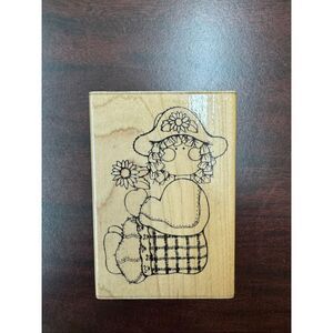 Sarah Doll Sitting and Holding a Flower Rubber Stamp